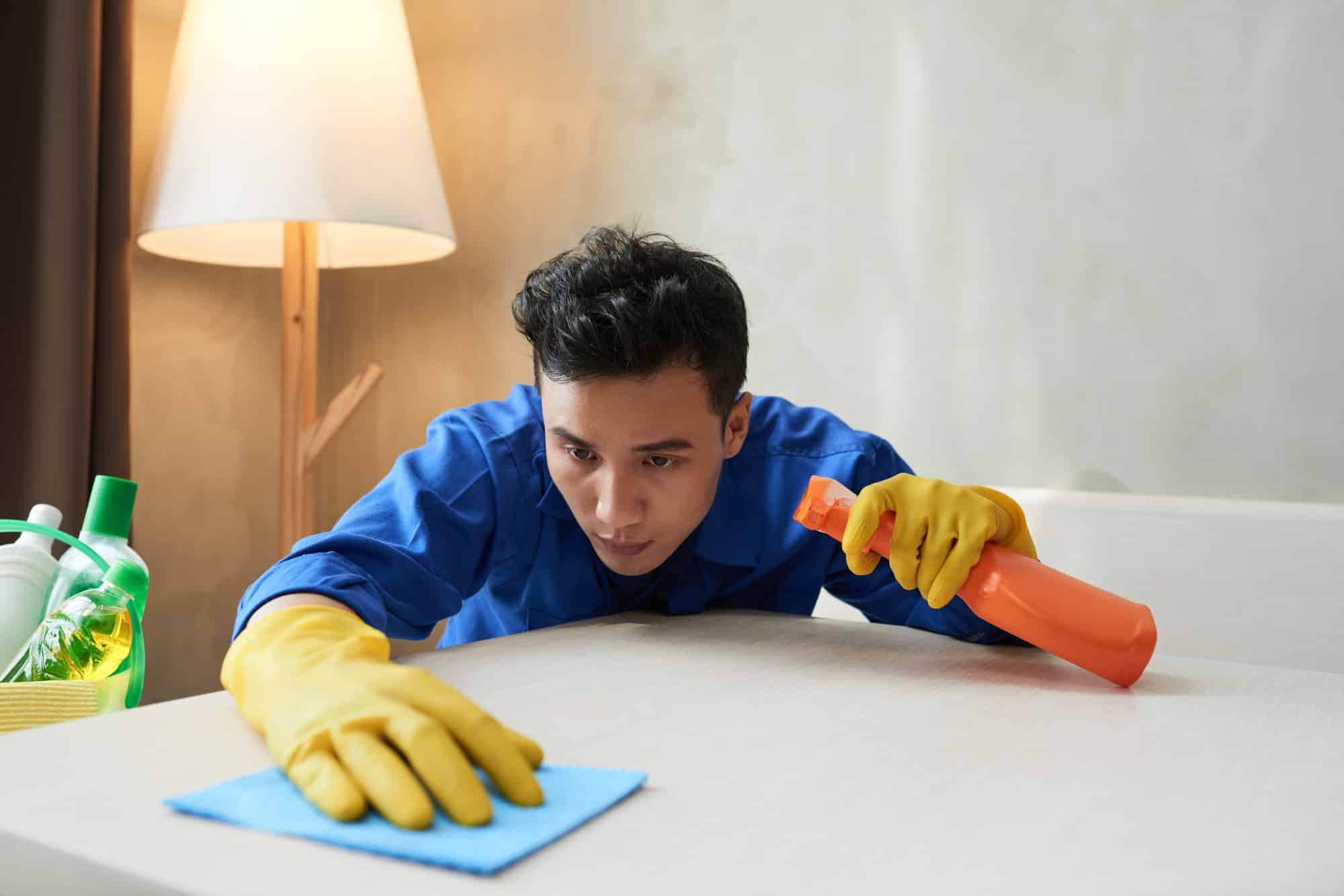 Man cleaning apartment